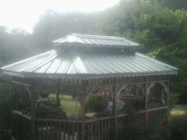 Two tier green metal roof on a garden gazebo in Glassboro